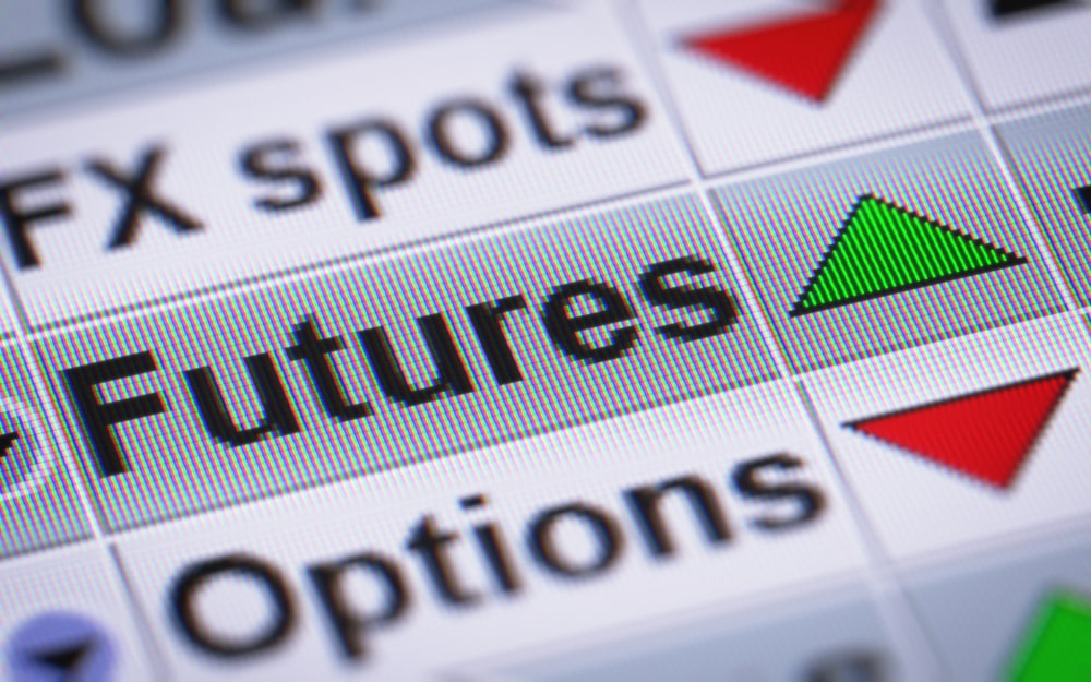 A green up arrow next to 'Futures' in a list of financial instruments.